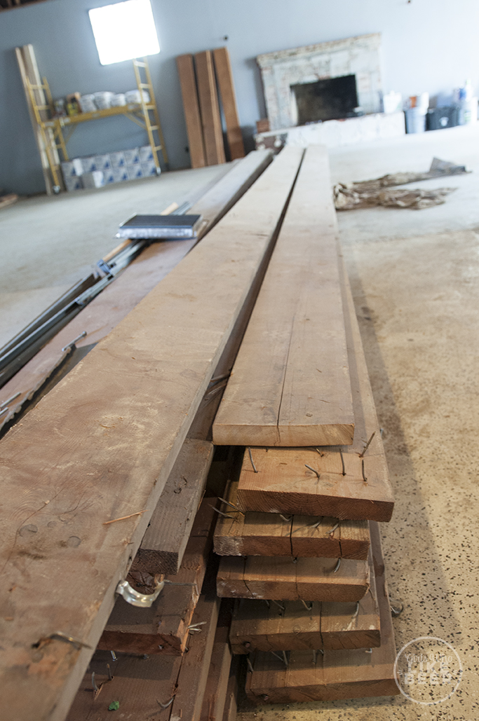 Repurposed wood soon to be a huge 20 foot table for the outdoor patio